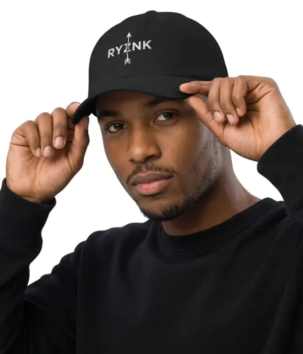 RYZNK Black Dad Hat — Man Adjusting Brim — Premium Embroidered Streetwear Cap