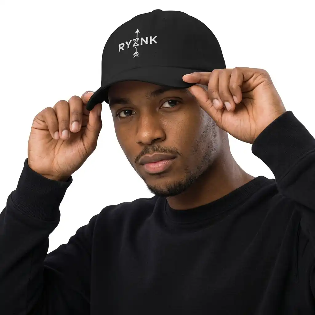 RYZNK Black Dad Hat — Man Adjusting Brim — Premium Embroidered Streetwear Cap