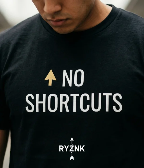 RYZNK No Shortcuts T-Shirt — Chest Close Up — Gold Arrow Streetwear Tee