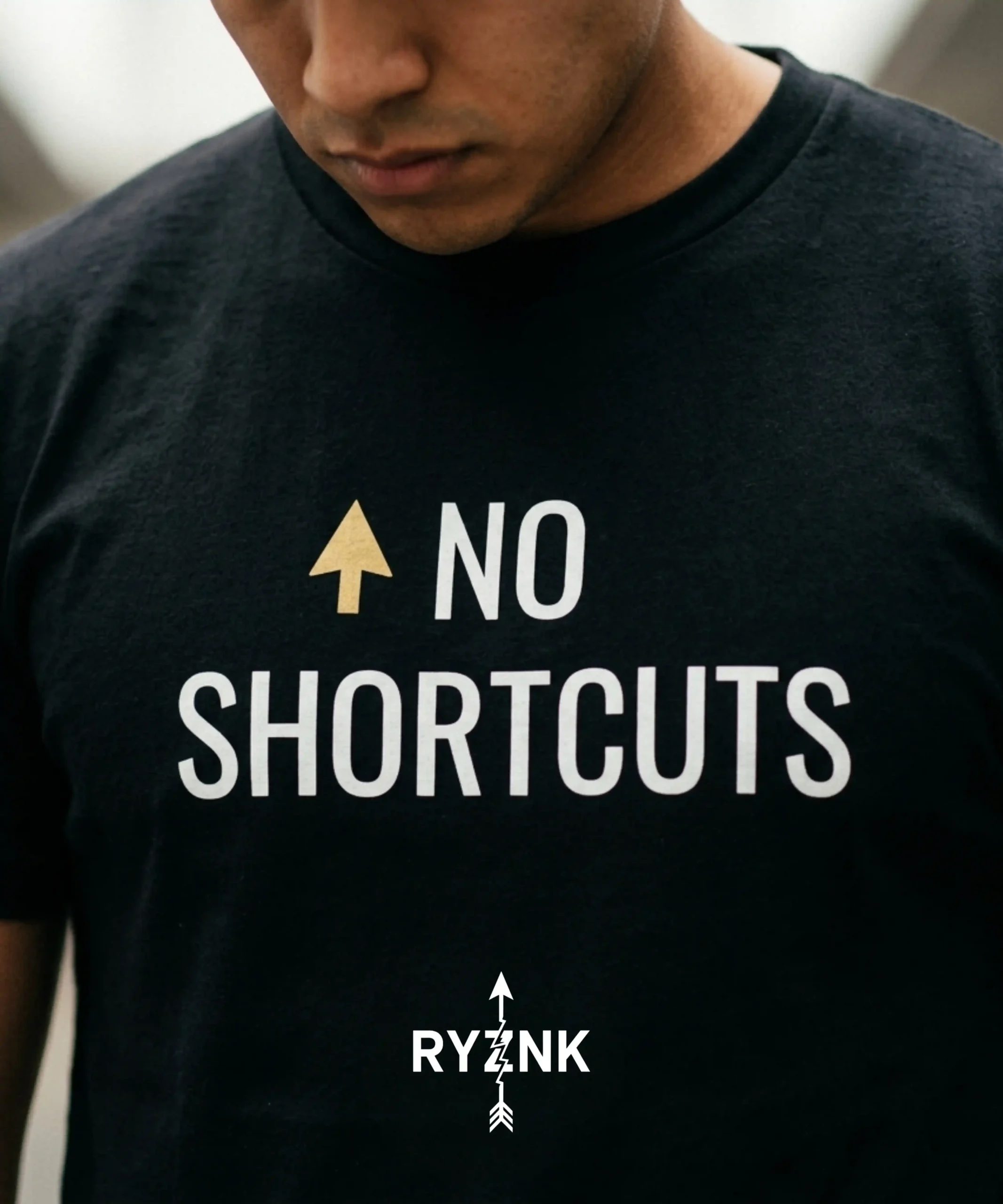 RYZNK No Shortcuts T-Shirt — Chest Close Up — Gold Arrow Streetwear Tee